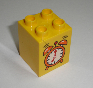 Lego Duplo D14000 (31110pb092) kostka 2x2x2 žlutá s potiskem (budík) POUŽITÉ
