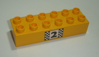 Lego Duplo D15417 (2300pb010) kostka 2x6 br. sv. oranžová s potiskem (stupně vítězů - pozice 2) POUŽITÉ
