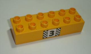 Lego Duplo D15418 (2300pb011) kostka 2x6 br. sv. oranžová s potiskem (stupně vítězů - pozice 3) POUŽITÉ