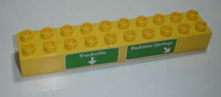 Lego Duplo D15461 (2291pb04) kostka 2x10 žlutá s potiskem (značka Truckville a Radiator Springs) POUŽITÉ