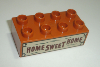 Lego Duplo D16089 (3011pb045) kostka 2x4 tm. oranžová s potiskem (nápis "HOME SWEET HOME", set 10856) 1 ks POUŽITÉ