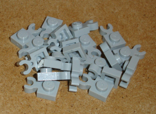 Lego 255335-X (4085d) destička speciální 1x1 s klipem 20 ks POUŽITÉ